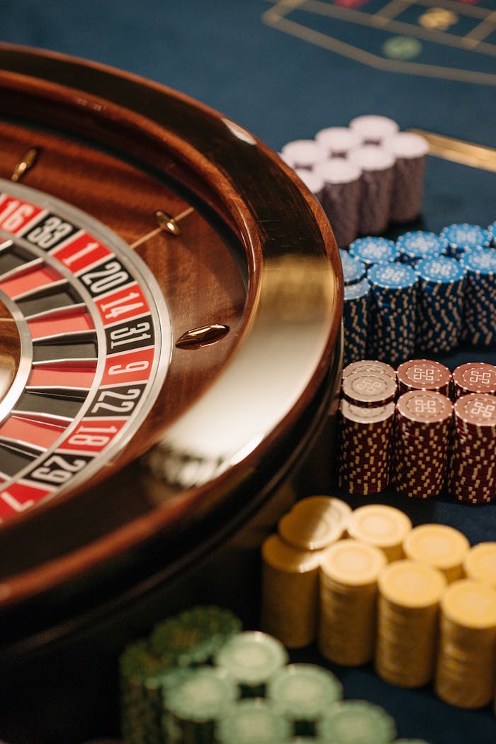 Close-up of a roulette table with colorful chips at a casino.